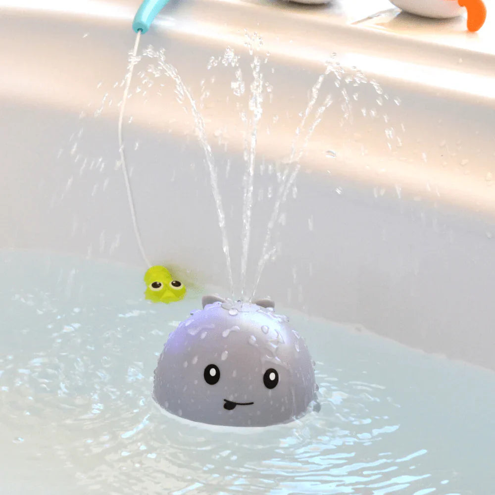Bath toy with water sprayer in a bathtub